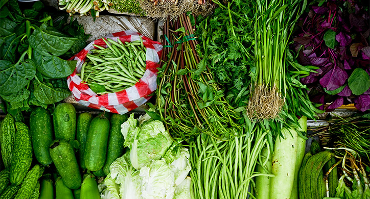 green vegetables on display at a market