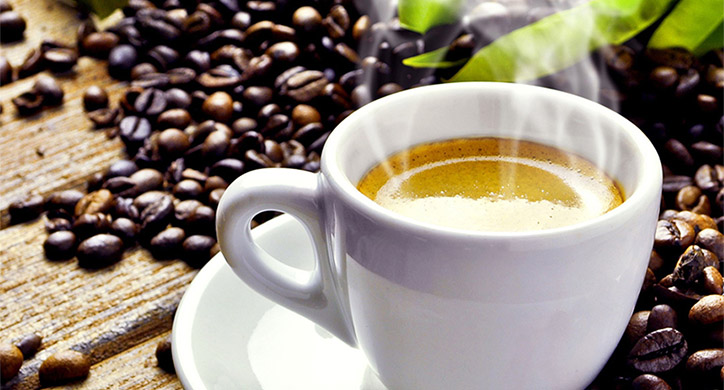 hot coffee mug with coffee beans